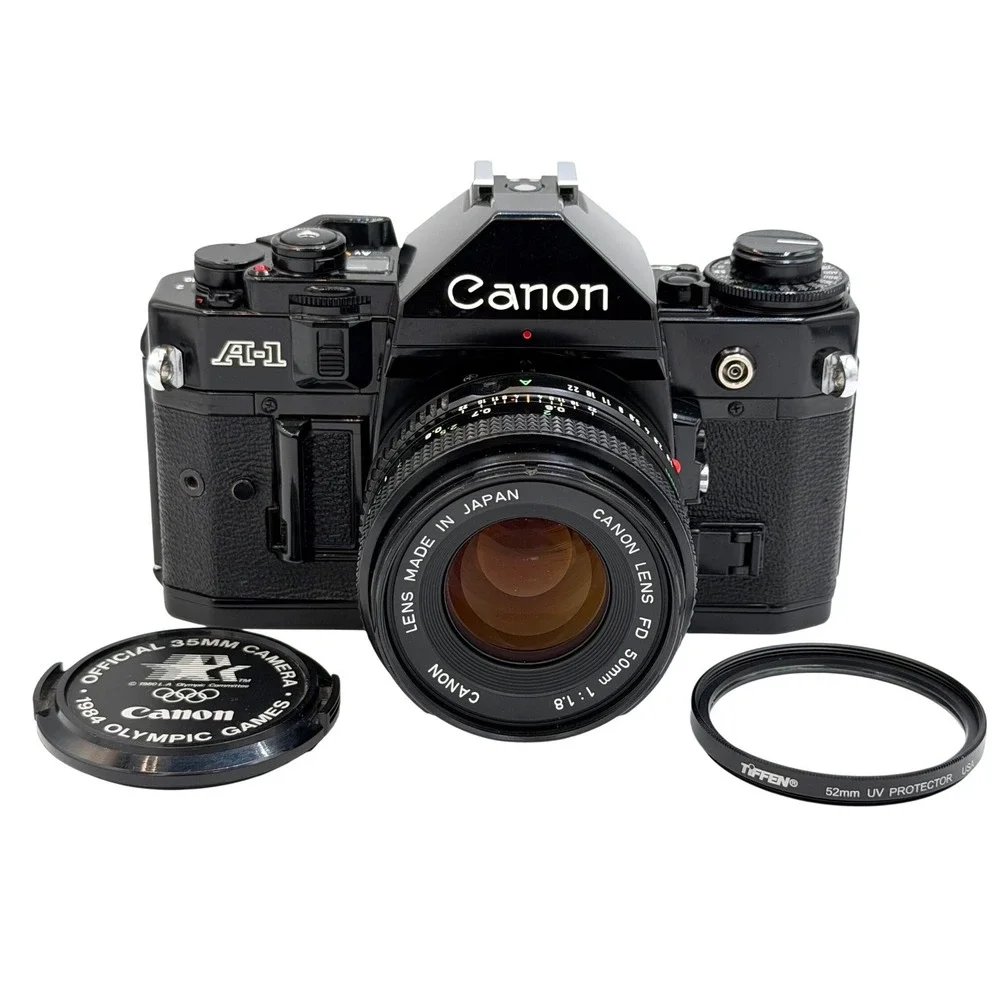 Canon A-1 35mm Film SLR Camera with FD 50mm 1:1.8 Lens, Filter, Cap Black TESTED